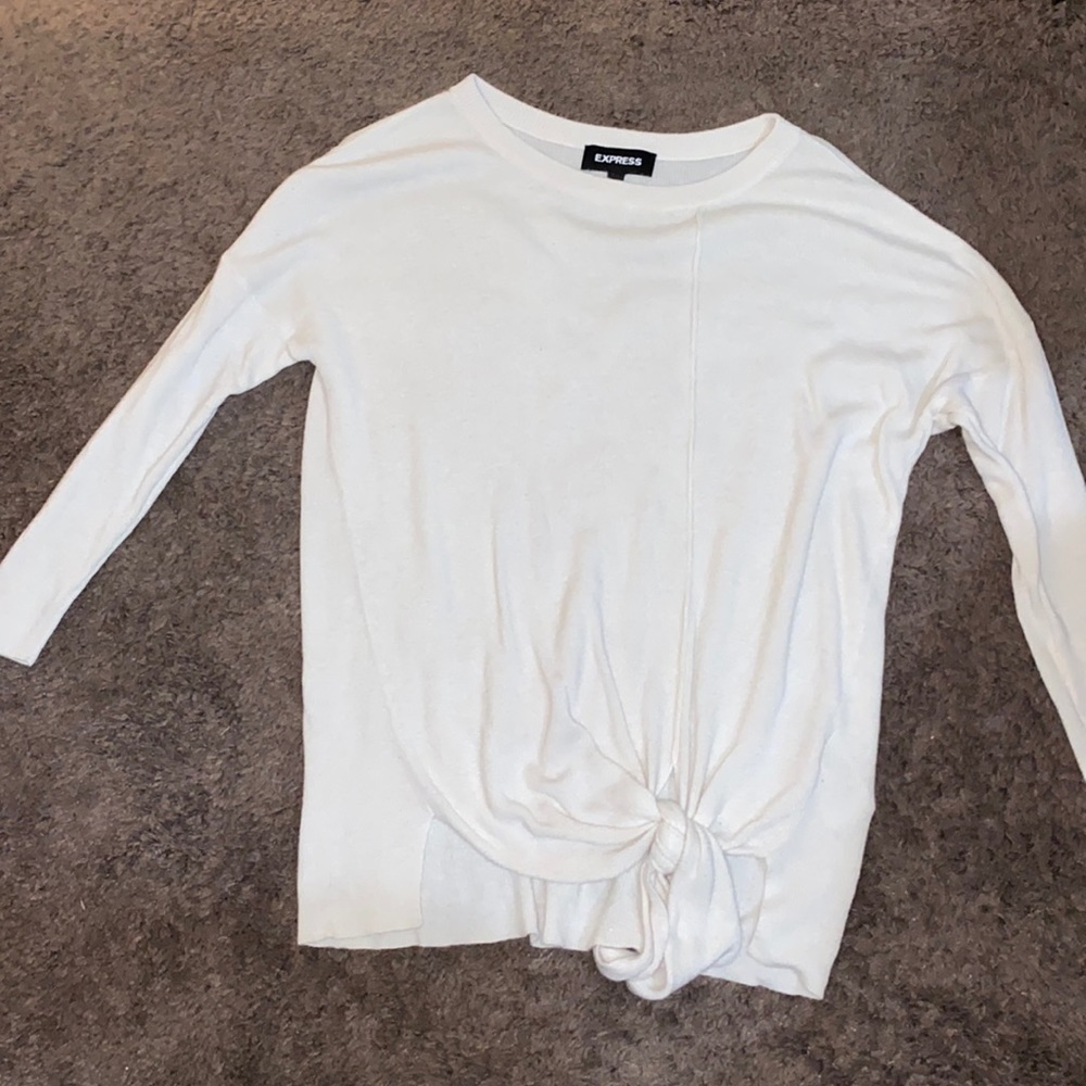 White knit top, ties at bottom